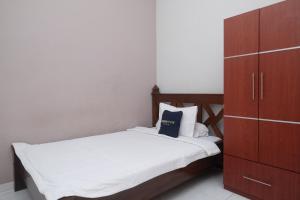 Postelja oz. postelje v sobi nastanitve Urbanview Syariah Wisma Wongso Borobudur