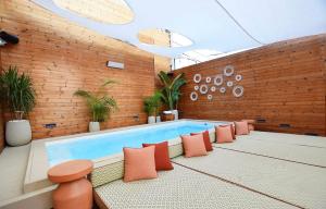 a swimming pool in a room with aitating at Castillo Tel Aviv in Tel Aviv