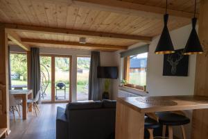 a living room with a couch and a table at Chaty pod Beskidkiem in Szczyrk