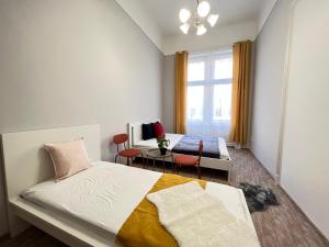 Postel nebo postele na pokoji v ubytování Baross Apartment with Convenience and Style