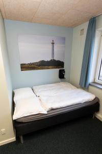 Postel nebo postele na pokoji v ubytování Hvide Sande Inn + 8 fotografií