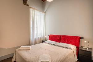 Ένα ή περισσότερα κρεβάτια σε δωμάτιο στο Apartment San Giorgio B - Lucca