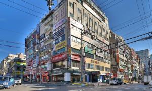 a large building with many signs on the side of it at Changwon Hotel Baba in Changwon