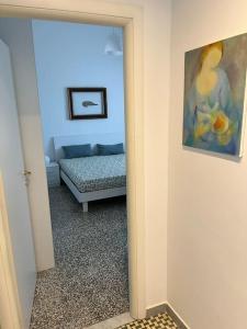 a living room with a couch and a mirror at Il Pesce di Legno in Livorno