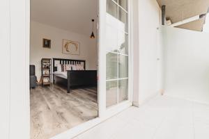 a hallway with a door leading to a living room at Schiller Studio 64 - free private parking in Braşov