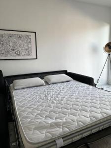 a mattress sitting on top of a bed in a room at Luminous appartment in Paris with balcony in Aubervilliers