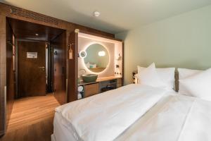 Voodi või voodid majutusasutuse Hotel Aare Thun toas