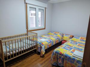 Ένα ή περισσότερα κρεβάτια σε δωμάτιο στο Piso Parque Eguren