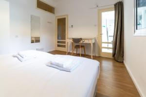 Кровать или кровати в номере Ziv Apartments - Gottlieb 4