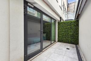 an entrance to a building with sliding glass doors at Buckingham Palace Residences by Q Apartments in London