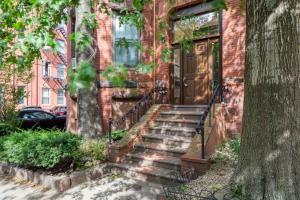a brick house with stairs leading to a door at Brookline 2br w public wd nr Fenway groceries BOS-909 in Brookline