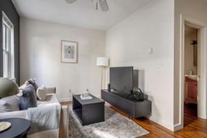 a living room with a couch and a table at South Boston 1br w building wd nr seaport BOS-913 in Boston
