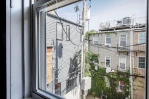 a window with a view of a building at South Boston 2br w building wd nr seaport BOS-914 in Boston