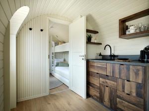 a kitchen with a door leading to a bunk bed at Iglupark in Tallinn