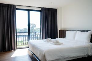 Postel nebo postele na pokoji v ubytování JS HOTEL