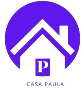 um círculo roxo com uma seta e um logótipo csa palula em Casa Paula em Las Playitas