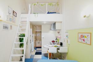 a room with a bunk bed and a desk at SC Heights 203 in Tokyo