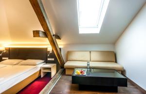 Posteľ alebo postele v izbe v ubytovaní BoutiqueHOTEL Donauwalzer