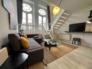 a living room with a couch and a table at P Sanz 1, 405 by YBH in Vigo