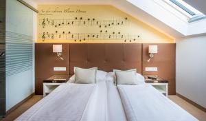 Posteľ alebo postele v izbe v ubytovaní BoutiqueHOTEL Donauwalzer