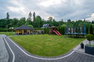 a park with a playground and a play equipment at Parzenica B&B - Wyjątkowa i Jedyna!!! Sprawdź nas a nie pożałujesz! in Białka Tatrzańska