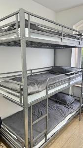 a couple of bunk beds in a room at Apartment mit 3 Betten, Küche & Bad in Kassel in Kassel