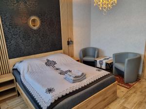 Postel nebo postele na pokoji v ubytování Willa "KomaNcza" Szczawnica