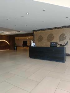 a lobby with a reception desk in a building at Mactan Newtown 2 Bedroom near Mactan Airport in Punta Engaño +44 photos