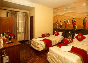 Postel nebo postele na pokoji v ubytování Kathmandu Eco Hotel