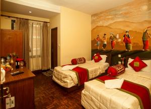 Giường trong phòng chung tại Kathmandu Eco Hotel