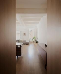 a living room with a couch and a table at Architect’s home pad - Valletta in Valletta