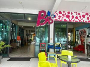 a restaurant with a table and chairs in front of it at BBHOUSE pattaya in Pattaya South