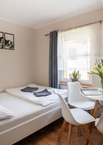 Postel nebo postele na pokoji v ubytování Pokoje Gościnne Izabela + 9 fotografií