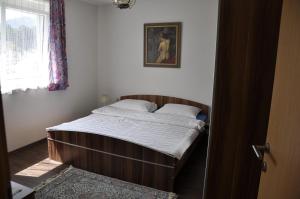 Postel nebo postele na pokoji v ubytování Hotel Martina