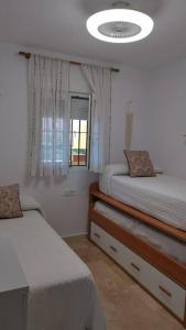Llit o llits en una habitació de Laguna Golf, Hoyo 17, Islantilla