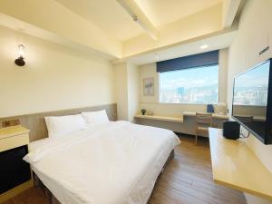 Postel nebo postele na pokoji v ubytování 小隱居Hermit Dorm-聖雄商旅