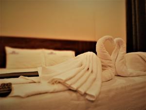 Postel nebo postele na pokoji v ubytování HOTEL ELITE