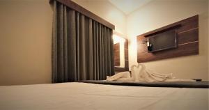 Postel nebo postele na pokoji v ubytování HOTEL ELITE