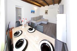 a living room with a couch and a table at Didovi dvori in Bibinje