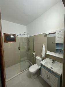 a bathroom with a shower and a toilet and a sink at Rus Villa in Berat