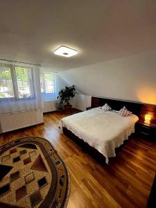 מיטה או מיטות בחדר ב-Casa Andreuță