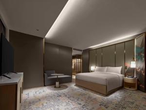 Postel nebo postele na pokoji v ubytování Doubletree By Hilton Nanning Wuxiang