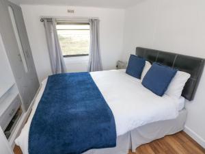Postel nebo postele na pokoji v ubytování Stable Lodge