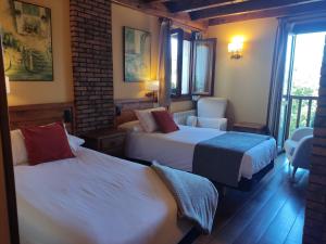 Giường trong phòng chung tại Hotel Rural Irati