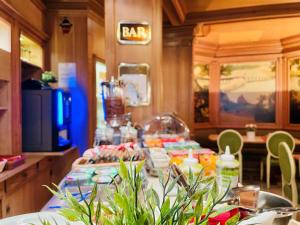 a long table with food on it in a restaurant at Murat in Paris