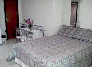 En eller flere senge i et værelse på Flat Tambaú frente mar