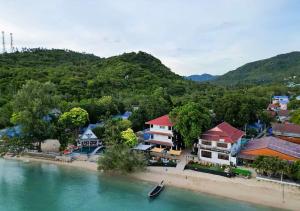 an aerial view of a town on a beach next to the water at Hydronauts Diving Resort - Koh Tao in Koh Tao