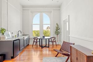 a kitchen with a table and chairs and a window at The McKey in Valdosta