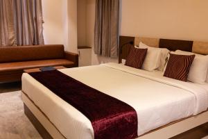 Letto o letti in una camera di Freesia Resort by Express Inn