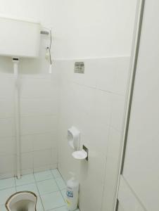 a bathroom with a toilet and a shower stall at The Loft Bentong in Bentong
